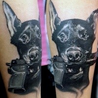 Cute looking colored forearm tattoo of dog with pistol in mouth