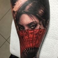 Cute looking colored mystic woman with fan stylized with skull