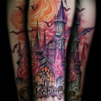 Cute old cartoon like horror castle tattoo on forearm with lettering