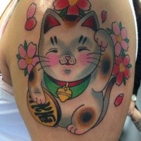 Cute old school style colored shoulder tattoo of maneki neko japanese lucky cat with pink flowers