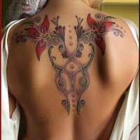 Cute painted and colored big floral tattoo on upper back