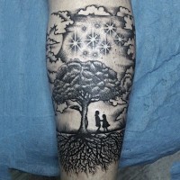 Cute painted little fantasy world like black ink tree with people tattoo on arm