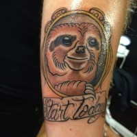 Cute simple painted and colored sloth portrait with lettering tattoo on arm