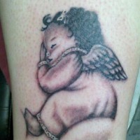 Cute sleeping cherub baby tattoo