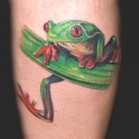 Cute small green frog tattoo