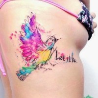 Cute watercolor bird tattoo on ribs