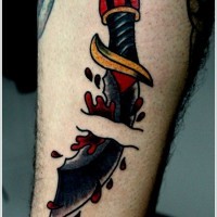 Dagger has pierced skin and blood drops tattoo