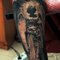 Dark angel tattoo on arm