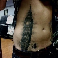 Dark black ink belly tattoo of Big Ben in sea