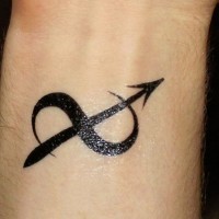 Dark black ink infinity symbol shaped Sagittarius symbol tattoo on wrist