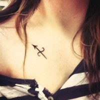 Dark black ink simple design Sagittarius symbol tattoo on girl's chest