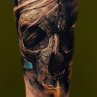 Dark broken human skull tattoo