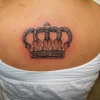 Delicate crown tattoo on upper back