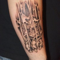 Demon climbs out through skin tattoo on forearm by fiesta