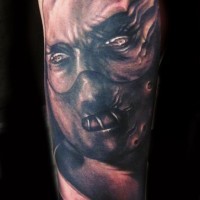 Demon tattoo on arm