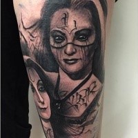 Demonic black ink forearm tattoo of of demonic woman face with bats