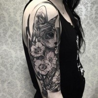 Designed cat and flowers tattoo on girl's shoulder in engraving style