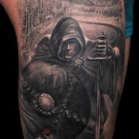 Detailed black and white cloaked man with sword and shield tattoo on shoulder