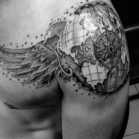 Detailed black and white shoulder tattoo of globe with wings and compass
