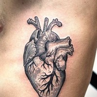 Detailed black lines heart tattoo on ribs