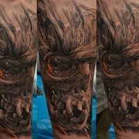 Detailed colored fantasy creepy skull tattoo on forearm