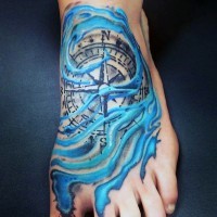Detailed compass and pale blue water waves foot tattoo
