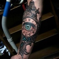 Detailed vintage style beautiful clock tattoo on forearm with human eye