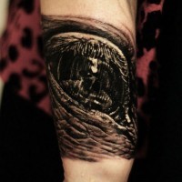 Disgusting black and gray eye tattoo on arm by Cris Gherman