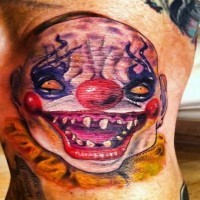 Übeler bunter Clown Tattoo am Arm