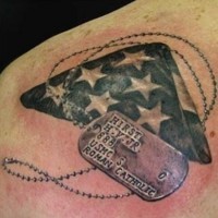 Dog tags and american flag memorial tattoo