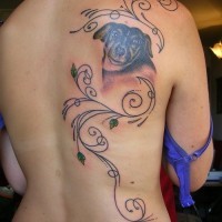 Dog with floral patterns tattoo on back for women