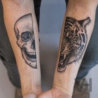 Dot style black ink split forearm tattoo of human and tiger heads by Valentin Hirsch