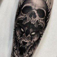Dot style creepy looking tattoo of demonic wolf with human skull