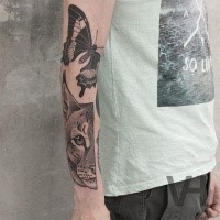 Dot style painted by Valentin Hirsch arm tattoo of split wild cat head