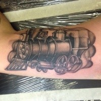 Dotwork style black ink biceps tattoo of old steamy train