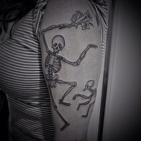 Dotwork style black ink upper arm tattoo of dancing skeleton with flowers