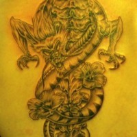 Dragon twists around the spinal column tattoo on back