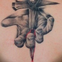 Dramatic Christian themed colored bloody hand tattoo on back