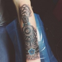 Dramatic memorial colored arm tattoo of train with flower and lettering