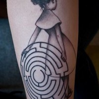 Dramatic style black and white little girl with hypnotic symbol tattoo on arm