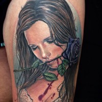 Dramatic style painted colored beautiful woman with violet rose  tattoo on thigh
