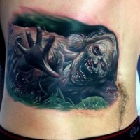 Dreadful creeping zombie tattoo on back