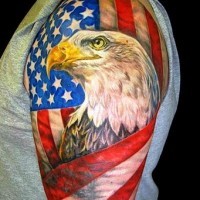 Eagle wrapped in american flag tattoo