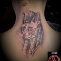 Egypt themed black ink upper back tattoo of mystical cat