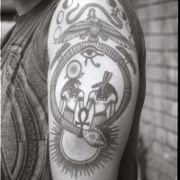 Egyptian deities and symbols of power tattoo on arm