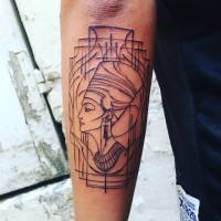 Egyptian Nefertiti black ink tattoo on arm with lined frame