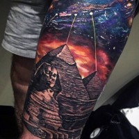 Egyptian pyramids and spaceship fantasy style multicolored massive thigh tattoo
