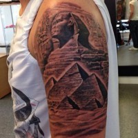 Egyptian pyramids scenery lifelike tattoo on half sleeve area