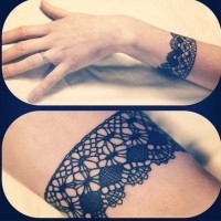 Elegant black lines lace wrist tattoo by Dodie