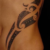 Elegant black polynesian tattoo on ribs